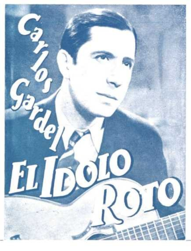Ein Plakat des spanischen Singer-Songwriters El Idolo Roro, der eine Gitarre hält und ein weißes Hemd und einen schwarzen Anzug trägt, mit einem hellblauen Hintergrund und fetter schwarzer Schrift.
