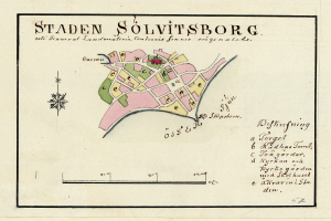Ein detaillierter Stadtplan von Staden Solvitsborg, Schweden, der Straßen, Gebäude und Sehenswürdigkeiten zeigt, mit handgeschriebener Schrift darauf.